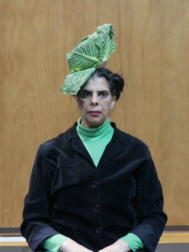 Woman with a cabbage on her head