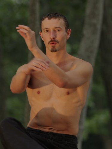 Cassiel Gaube with his hands in front of him.