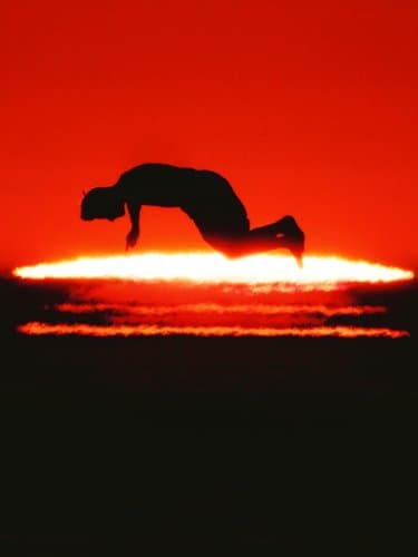 a silhouette in a red halo