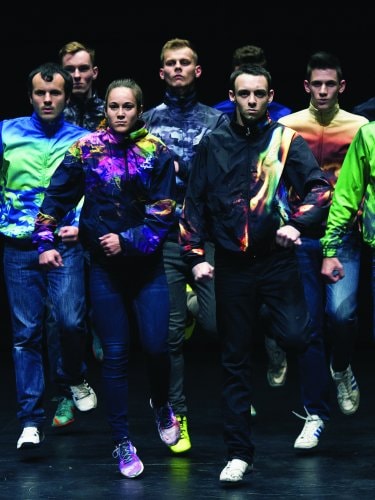 a group of dancers marching forward