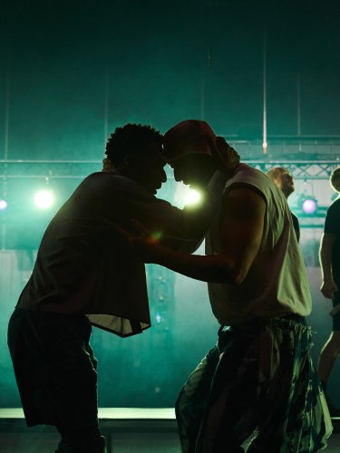 Duos of dancers facing each other.