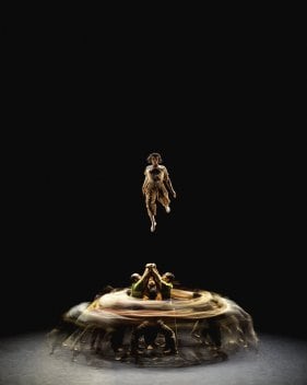 Group image with a swirling visual effect and one dancer in the air