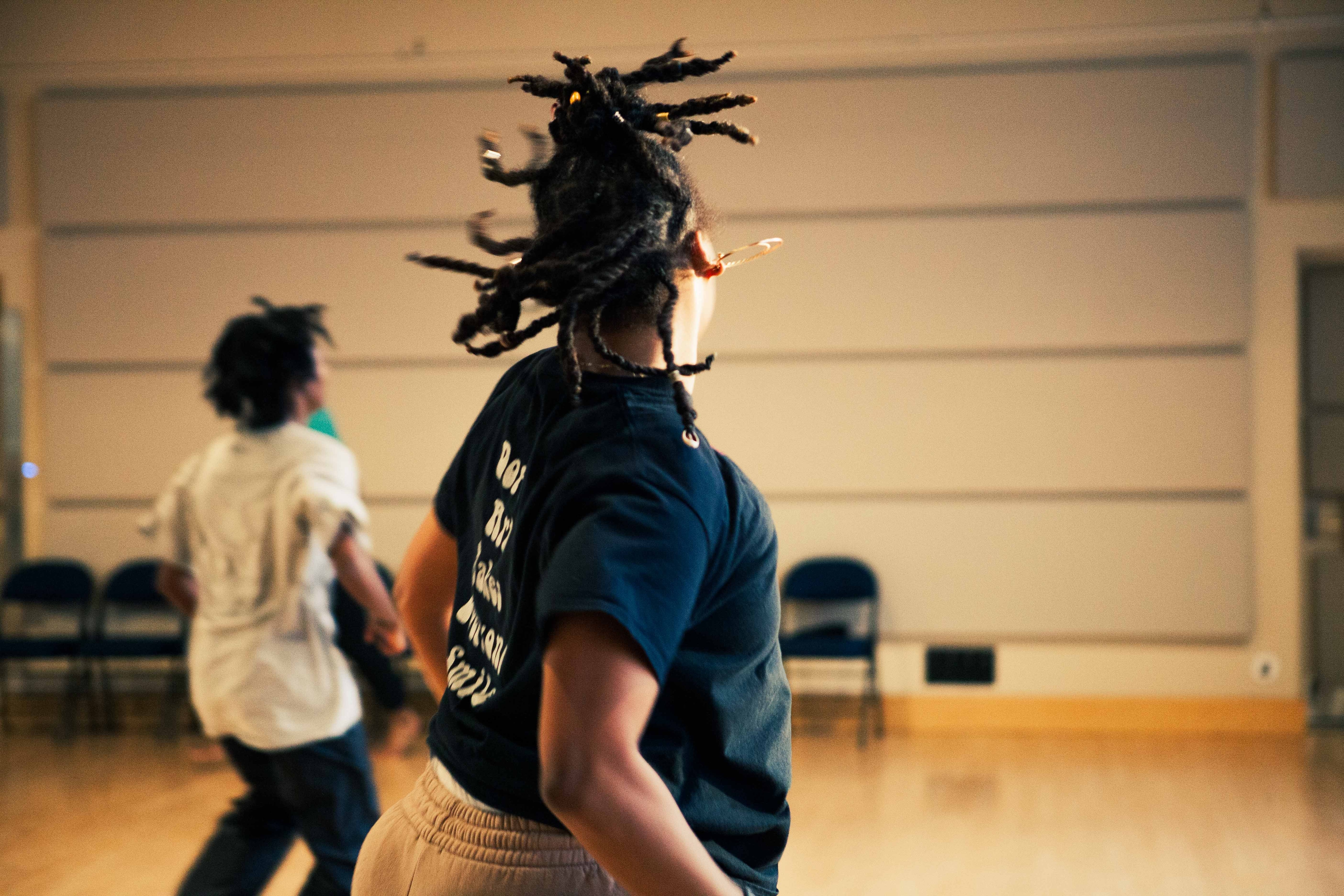 dancers moving and turning in dance studio 