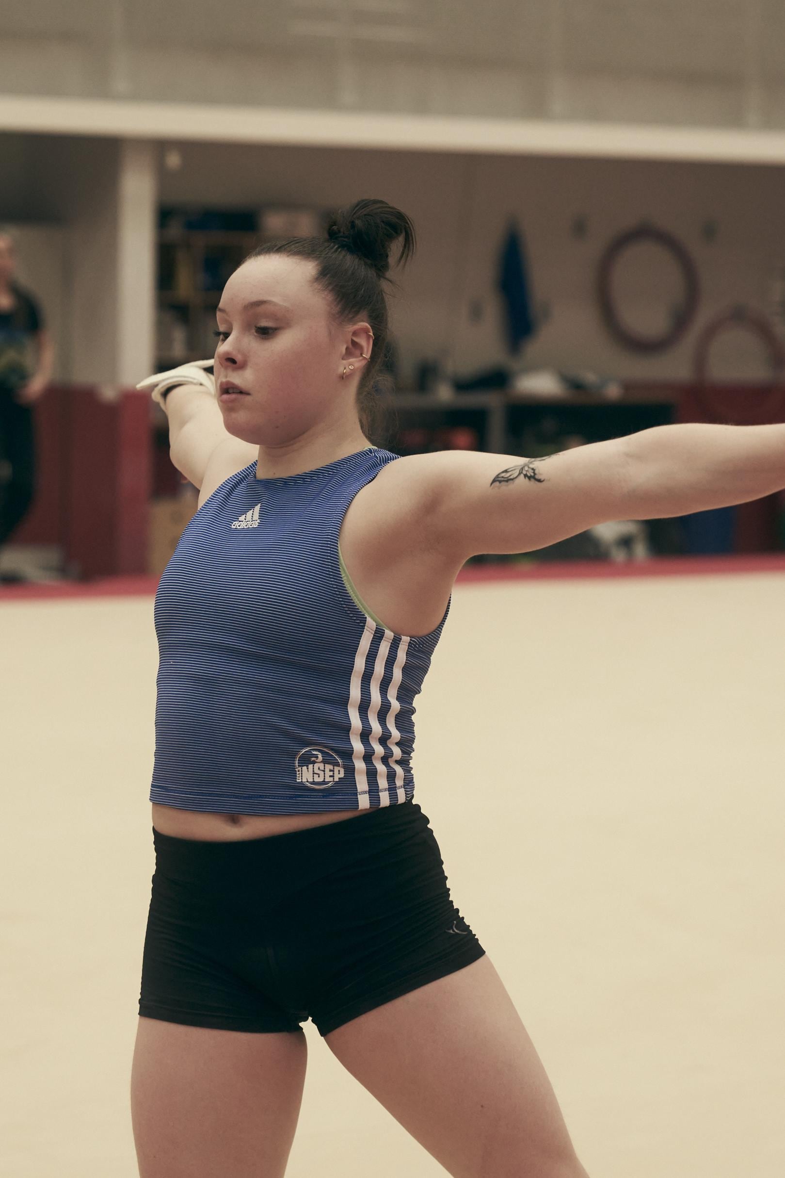 gymnast with open arms