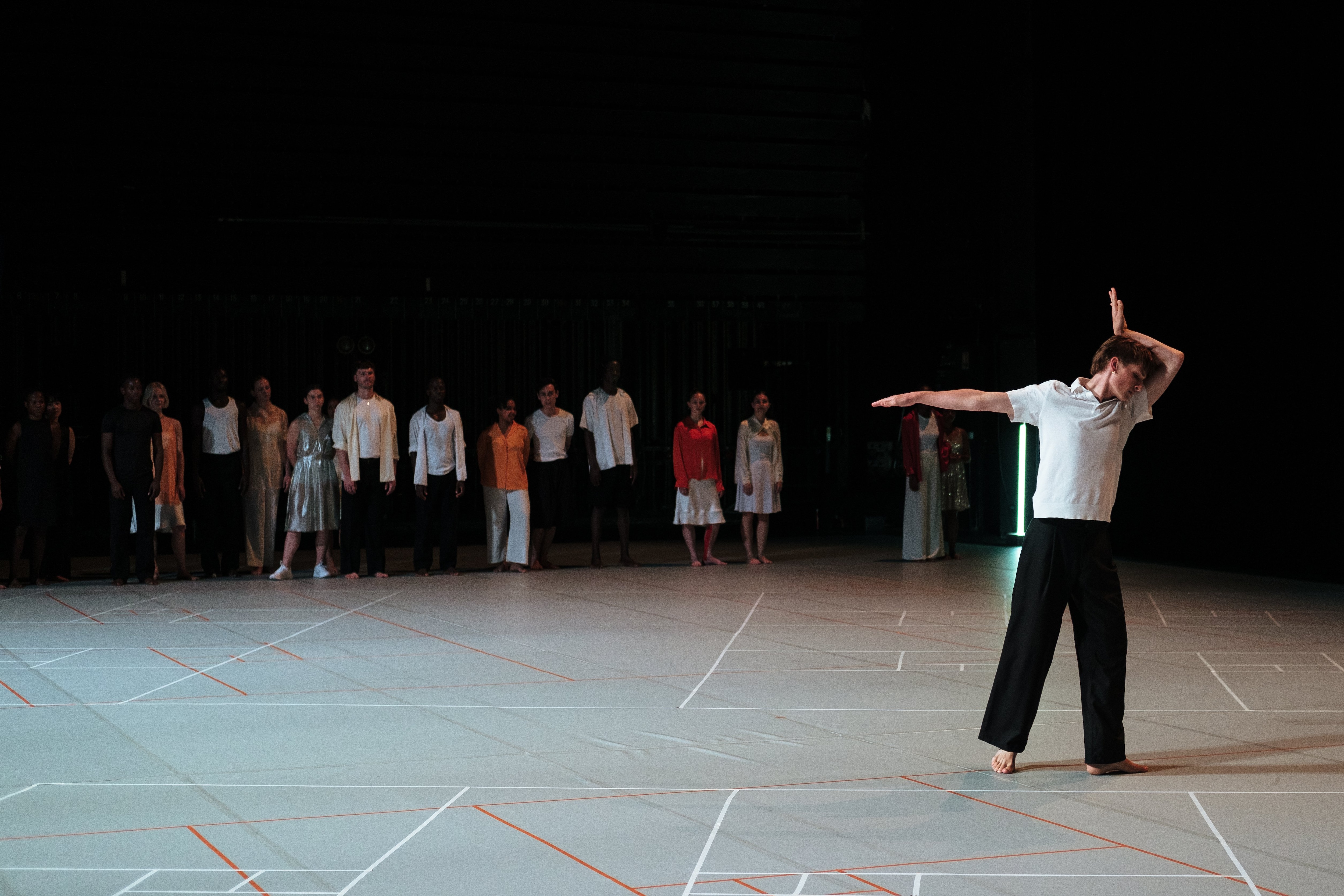 Solo dancer in front of the other members of the group