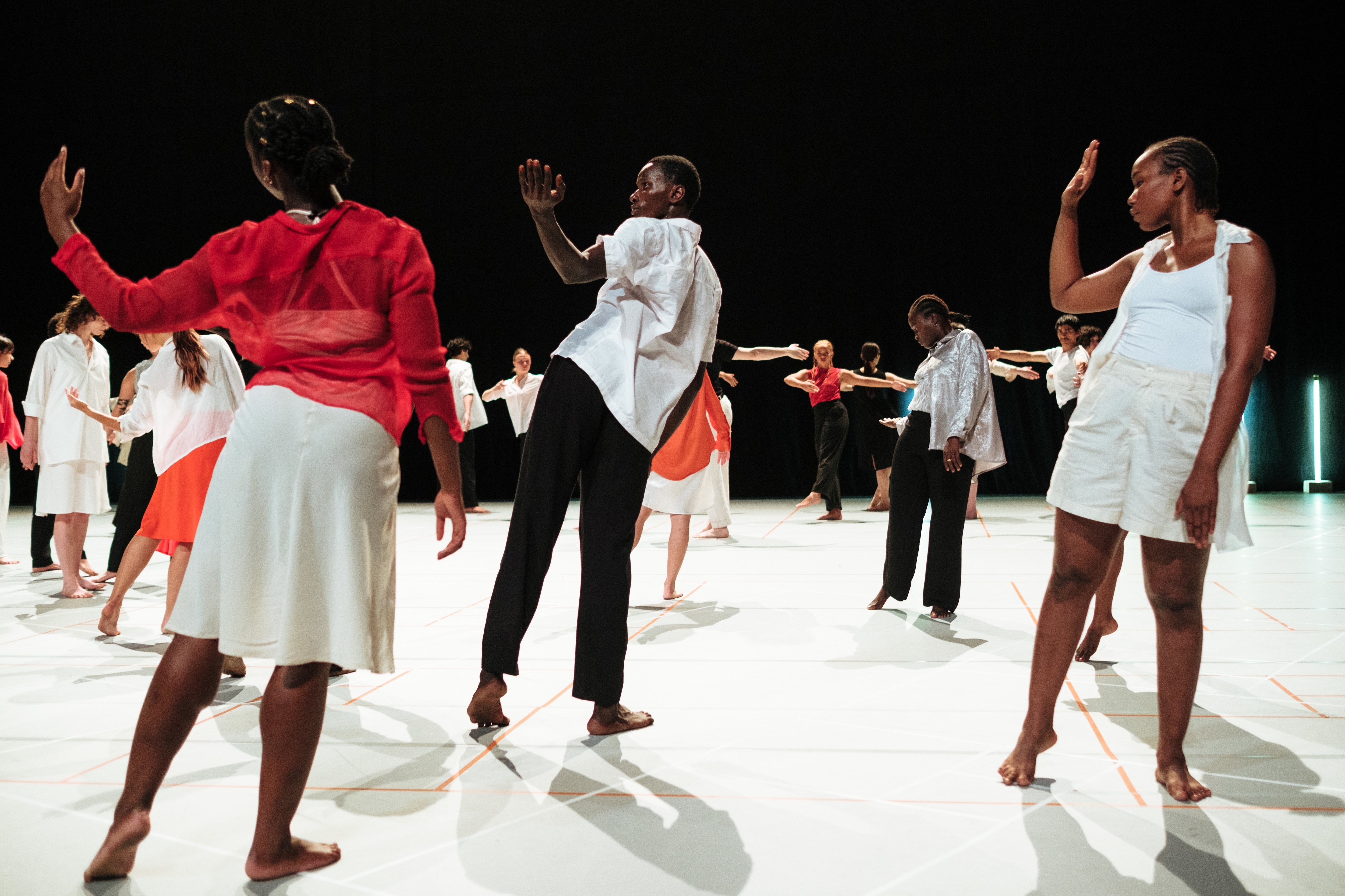 Group of dancers doing an arm movement
