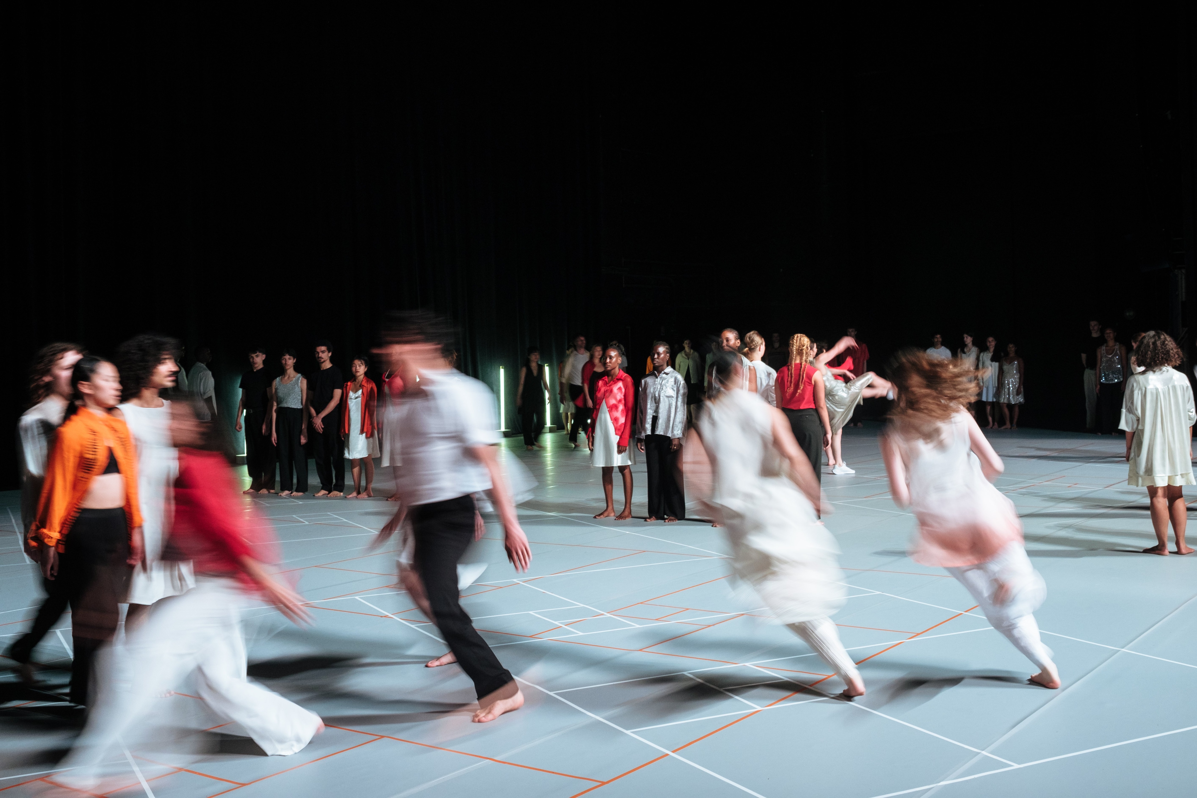 Group of dancers running on stage