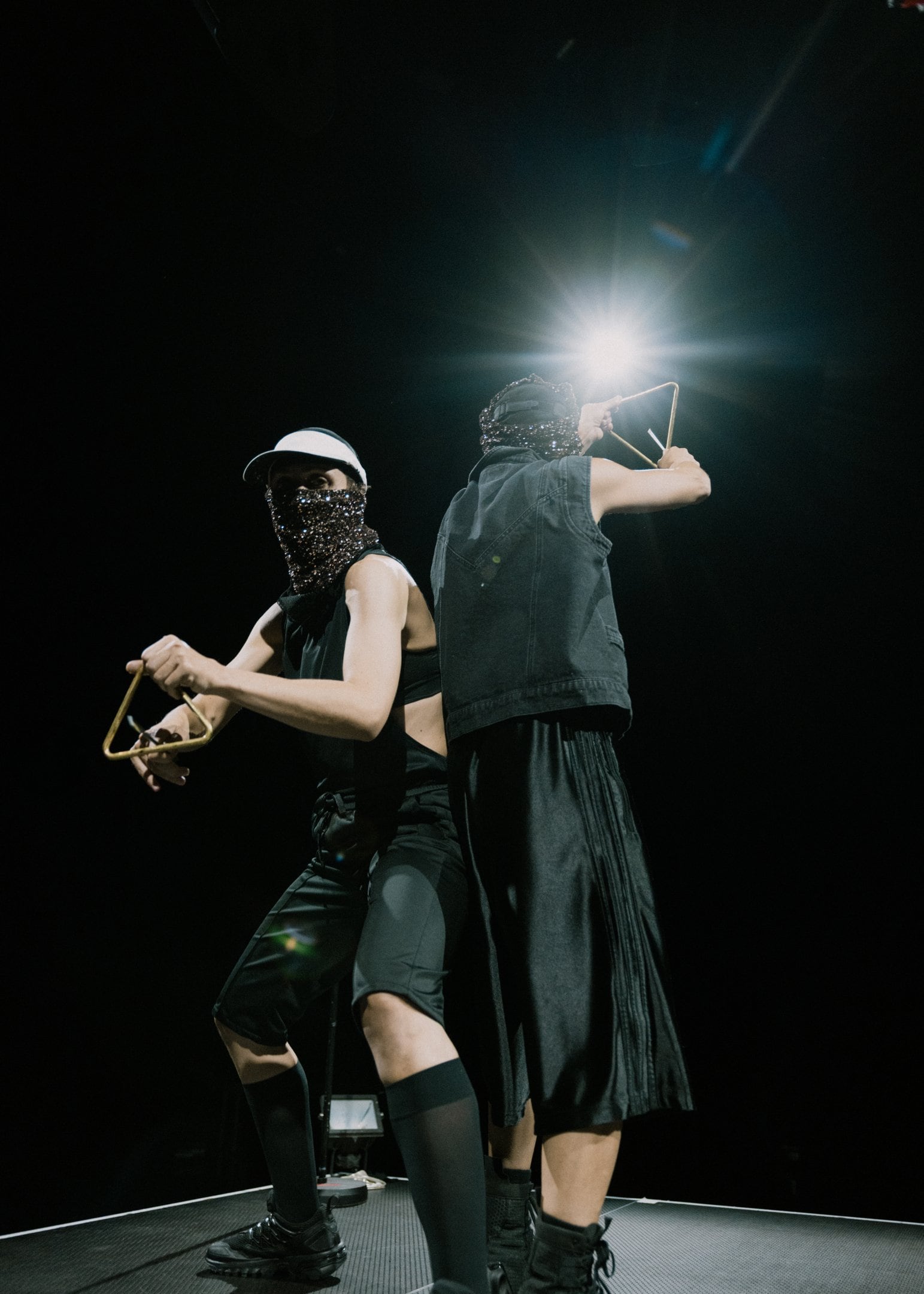 Two dancers dressed in black, full-length photo