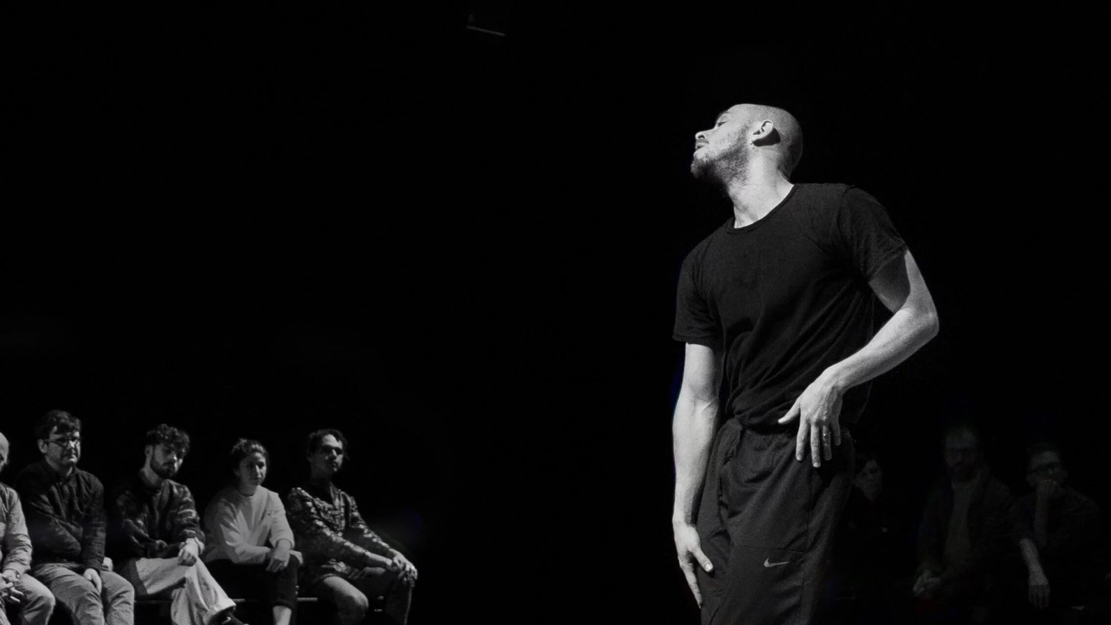 Adam Linder performing on stage