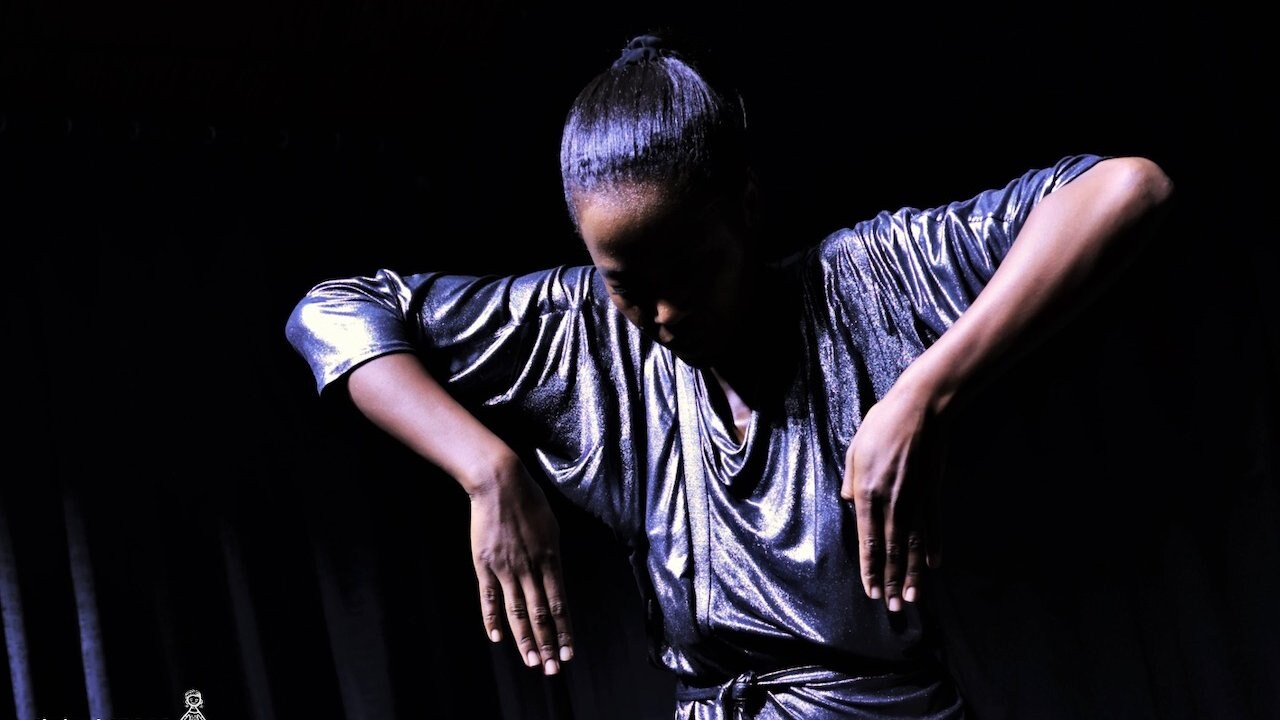 Dancer with elbows in the air