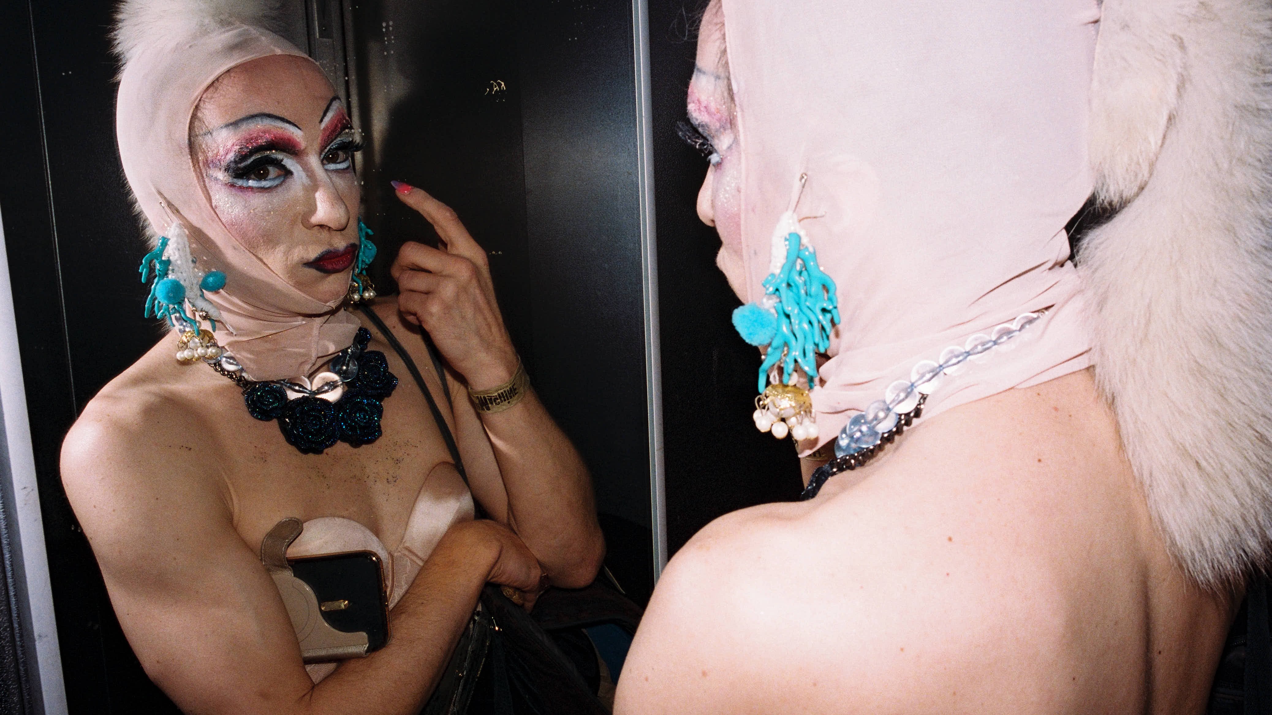 Dancer looking at himself in the mirror.