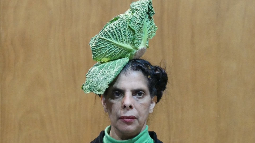 Woman with a cabbage on her head
