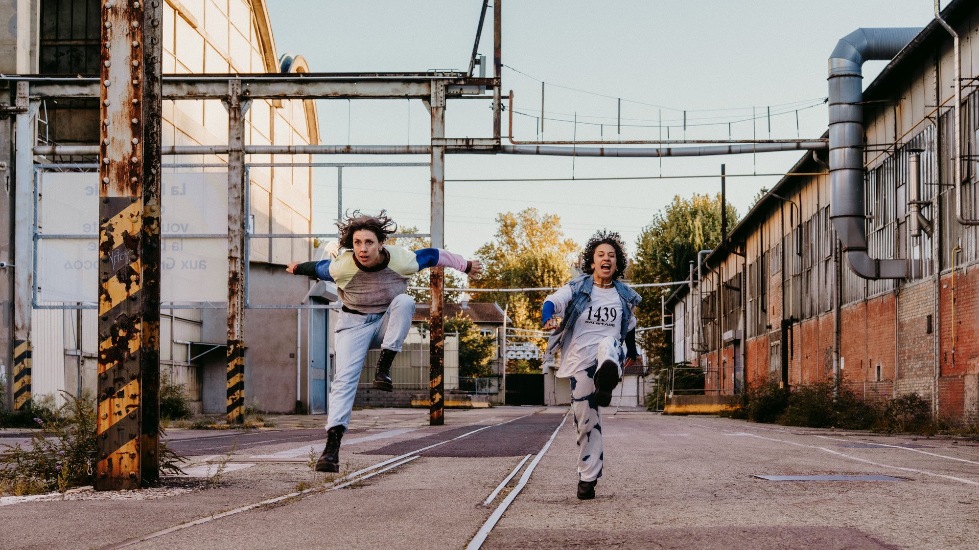 choreographers running and shouting in a street 