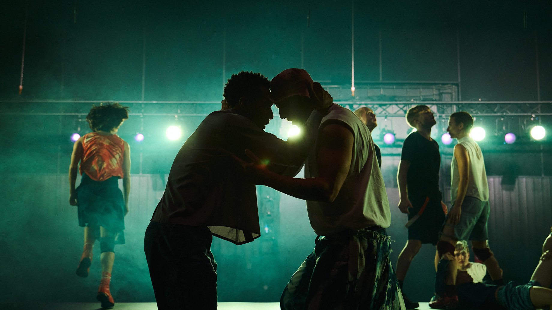 Duos of dancers facing each other.